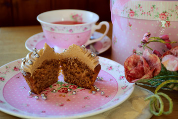 Chocolate muffin and roses with vintage background