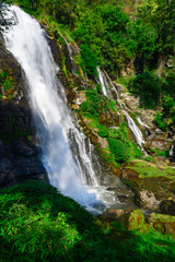 Fototapeta na wymiar Waterfall in the green tropical forest.