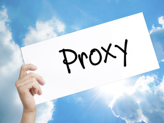 Proxy Sign on white paper. Man Hand Holding Paper with text. Isolated on sky background.