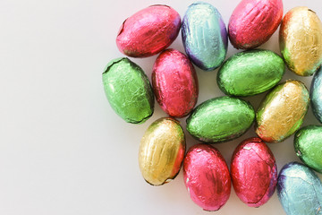 Fototapeta na wymiar multicolored Easter eggs on white background with space for write