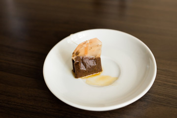 Used Tea Bag on White plate