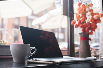 Coffee cup , laptop in coffee shop , for business,