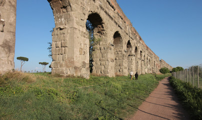 Fototapeta na wymiar Roman aqueduct Aqua Claudia in the Parco degli Acquedotti public park in Rome, Italy. It is part of the Appian Way Regional Park and is of approximately 240 ha. 
