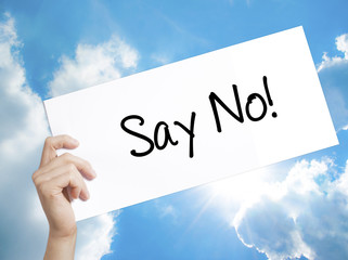 Say No! Sign on white paper. Man Hand Holding Paper with text. Isolated on sky background