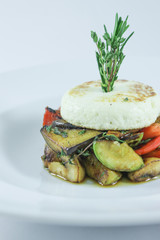 Hot smoked kaponat vegetables with baked cheese