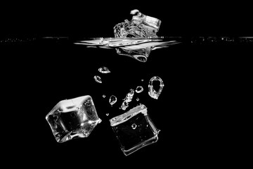 ice splash in water on black background