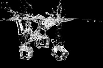 ice splash in water on black background
