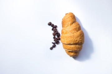 croissant, nd coffee beans on white background,