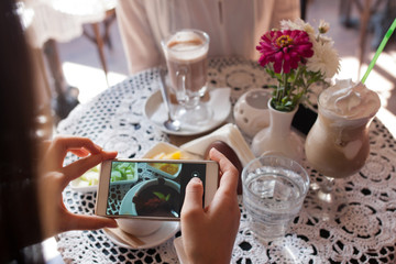 people, technology, eating and dating concept - close up
