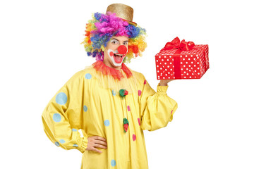 Joyful clown with a present