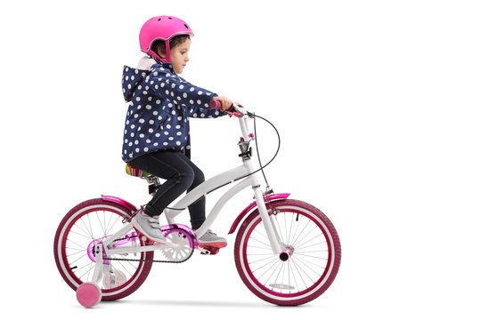 Cute little girl riding a bike