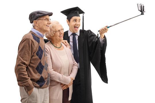 Graduate student taking a selfie with his grandparents
