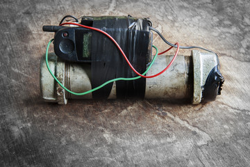 Steel pipe explosive (IED) is ignited by cell phone.