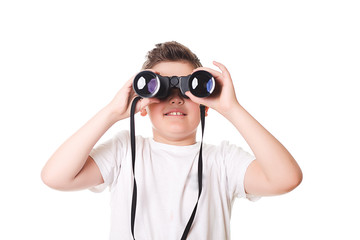 little boy is looking through binoculars. Isolated over white