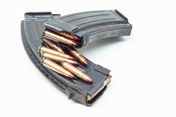 rifle bullet and ammunition pouch on white background:Choose a focal point ammunition lying.