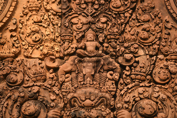 Fototapeta na wymiar Sculptures on Banteay Srei temple, Angkor Wat Cambodia.
