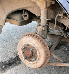 old rusted brake drum on an old car