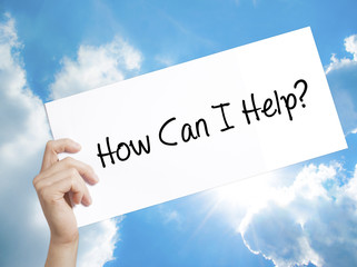 How Can I Help? Sign on white paper. Man Hand Holding Paper with text. Isolated on sky background