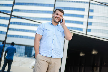 man in the street with a phone