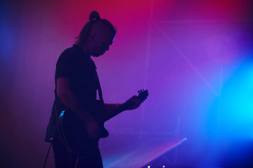 Guitarist performing on stage. Concert.