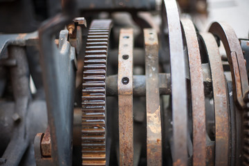 Old rusty printing machine complex mechanism of metal