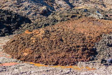 Piles of soil deposits at landfill over old dump.