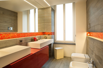 Modern style bathroom with double sink, warm colors