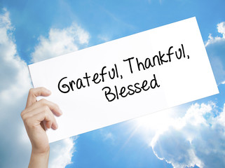  Grateful Thankful Blessed Sign on white paper. Man Hand Holding Paper with text. Isolated on sky...
