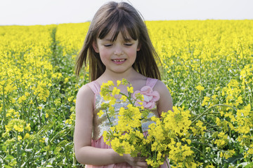 The little girl in a field of flowers