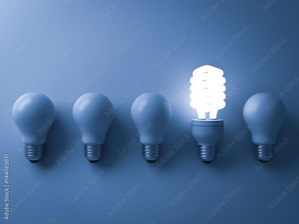 Aufkleber Energy saving light bulb , one glowing compact fluorescent lightbulb standing out from unlit incandescent bulbs on blue background , individuality and different creative idea concepts . 3D rendering.