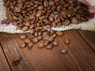COFFEE GRAIN IN A BAG ON A RURAL TABLE