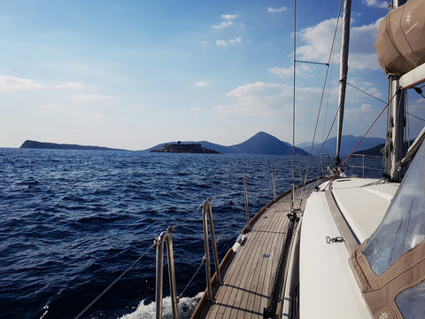 Yacht sails on the blue sea