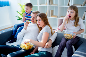 Family watching a film