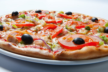 Italian delicious pizza with tomato, broccoli and cheese.