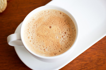 Coffee with white cup on wooden background