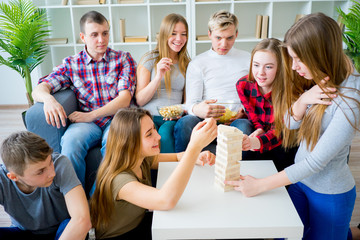 Friends playing jenga