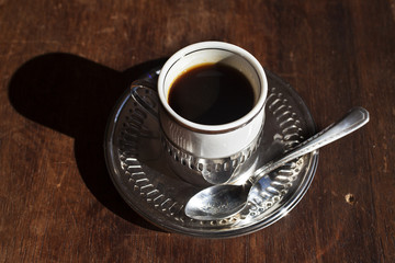 Cup of Coffee over wood background