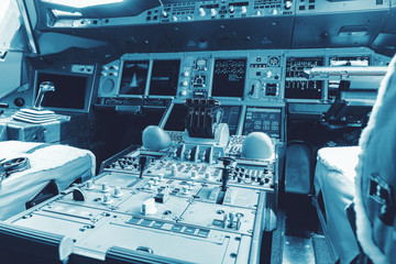 Dashboard and center console of the largest passenger aircraft Airbus A380-800. Cockpit of Airbus A380, largest passenger airliner in the world.