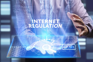Business, Technology, Internet and network concept. Young businessman working on a virtual screen of the future and sees the inscription: Internet regulation