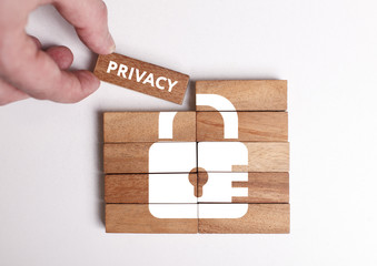 Business, Technology, Internet and network concept. Young businessman shows the word: Privacy - obrazy, fototapety, plakaty