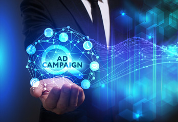Fototapeta premium Business, Technology, Internet and network concept. Young businessman working on a virtual screen of the future and sees the inscription: Ad campaign