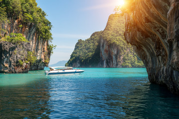 Beautiful landscape of rocks mountain and crystal clear sea with speed boat at Phuket, Thailand....