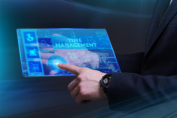 Business, Technology, Internet and network concept. Young businessman working on a virtual screen of the future and sees the inscription: Time management