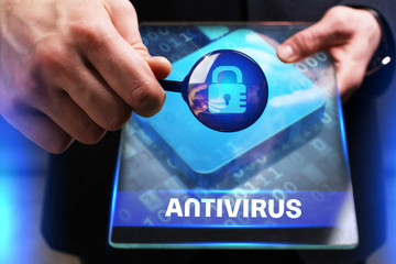 Business, Technology, Internet and network concept. Young businessman working on a virtual screen of the future and sees the inscription: Antivirus