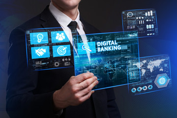 Business, Technology, Internet and network concept. Young businessman working on a virtual screen of the future and sees the inscription: Digital banking