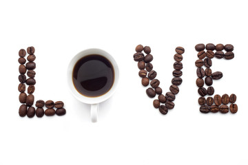 Word love made of beans over white background.