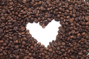 Heart shape made of Coffee beans over seeds background