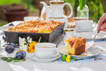 Sweet cake with plum served with coffee in summer