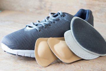 Gray running shoes with orthopedic insoles