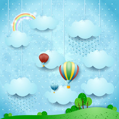 Surreal landscape with rain and hot air balloons